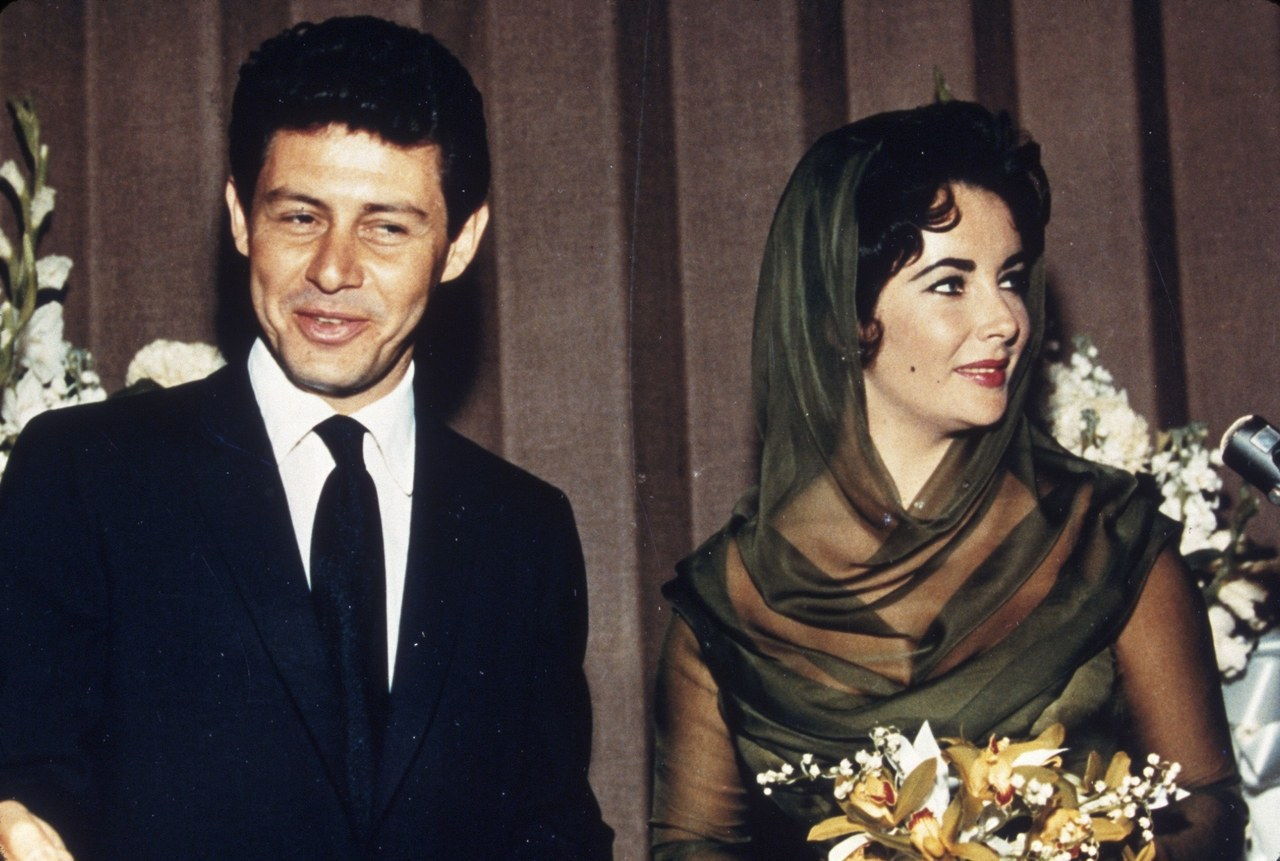 No Merchandising. Editorial Use Only Mandatory Credit: Photo by SNAP/REX/Shutterstock (390871bh) FILM STILLS OF 1959, EDDIE FISHER, GETTING MARRIED, ELIZABETH TAYLOR, WEDDING, WEDDINGS/BRIDES, CHIFFON, MOLE, MOLE ON FACE, MARRIAGE, HUSBAND, HUSBANDS, LIZ TAYLOR IN 1959 VARIOUS 