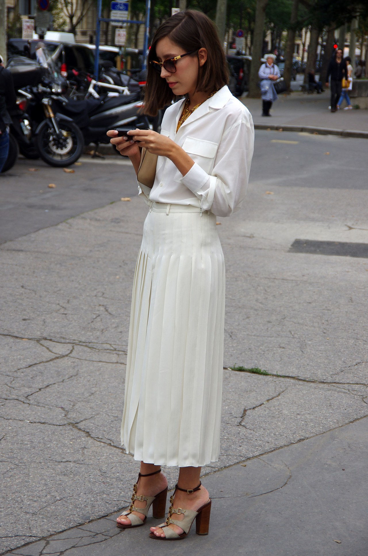 white shirt outfit ideas work white pleated skirt getty images