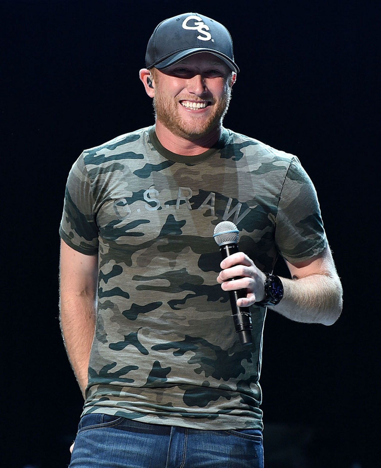 cole swindell country singer camo shirt on stage