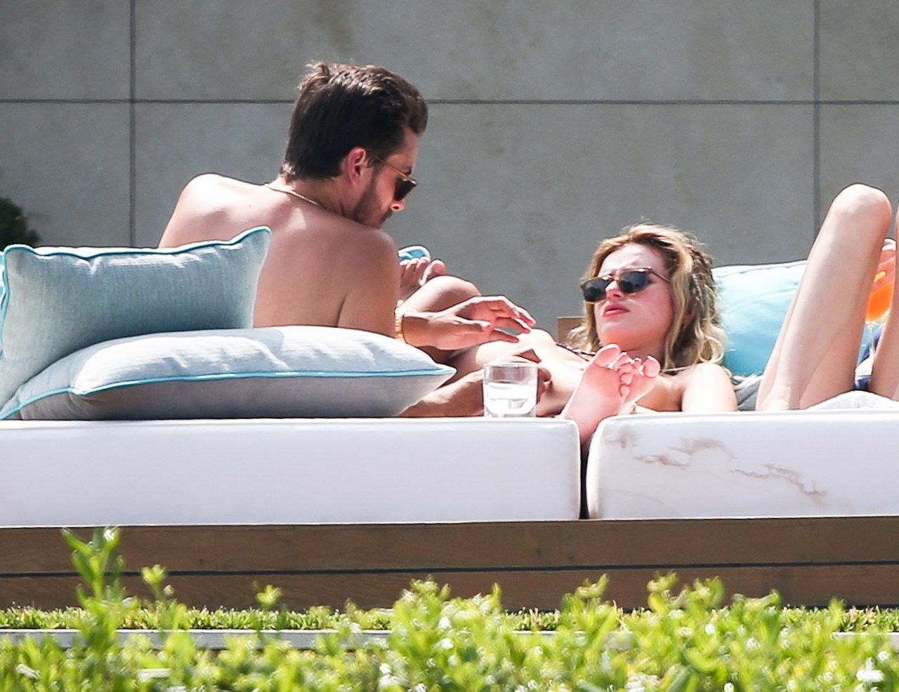 Scott Disick squeezes girlfriend Bella Thornes breast as they sunbathe in Cannes