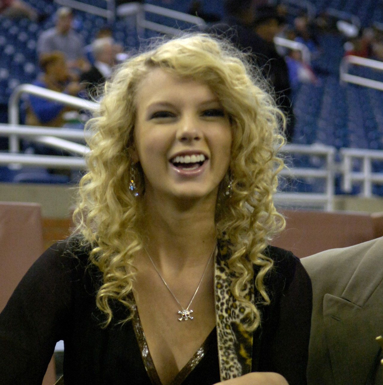 Taylor Swift sings the National Anthem as the Detroit Lions host the Miami Dolphins in a Thanksgiving Day game Nov. 23, 2006 in Detroit.