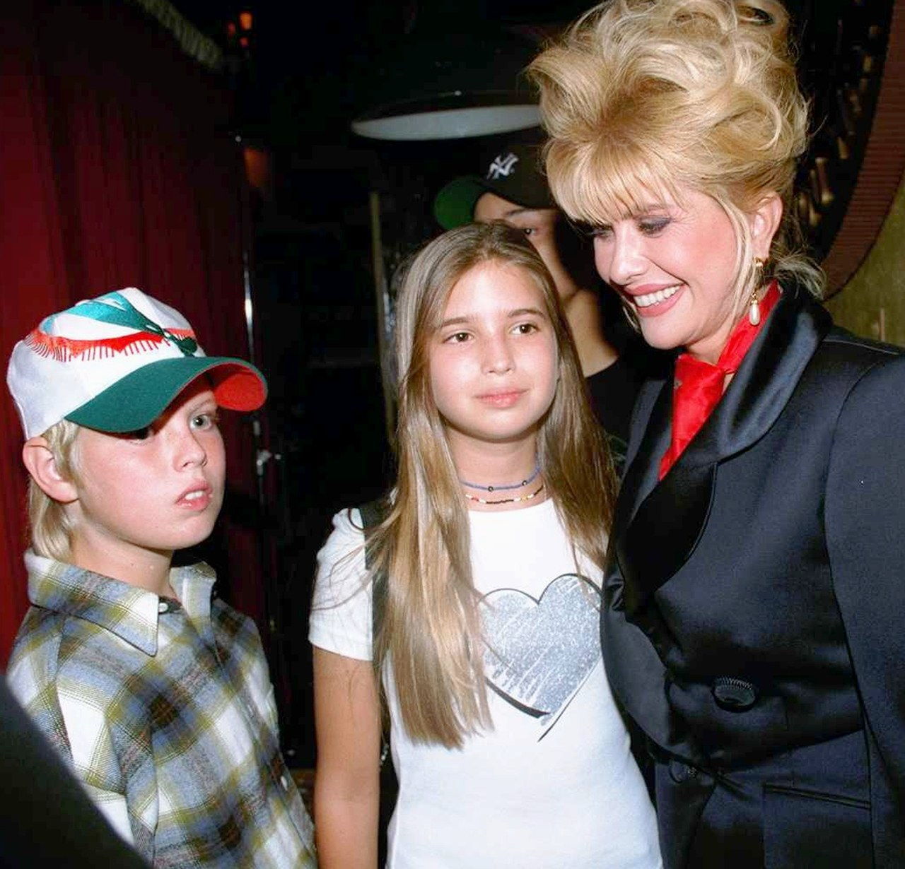 Ivana Trump with her children Eric and Ivanka attending a pa