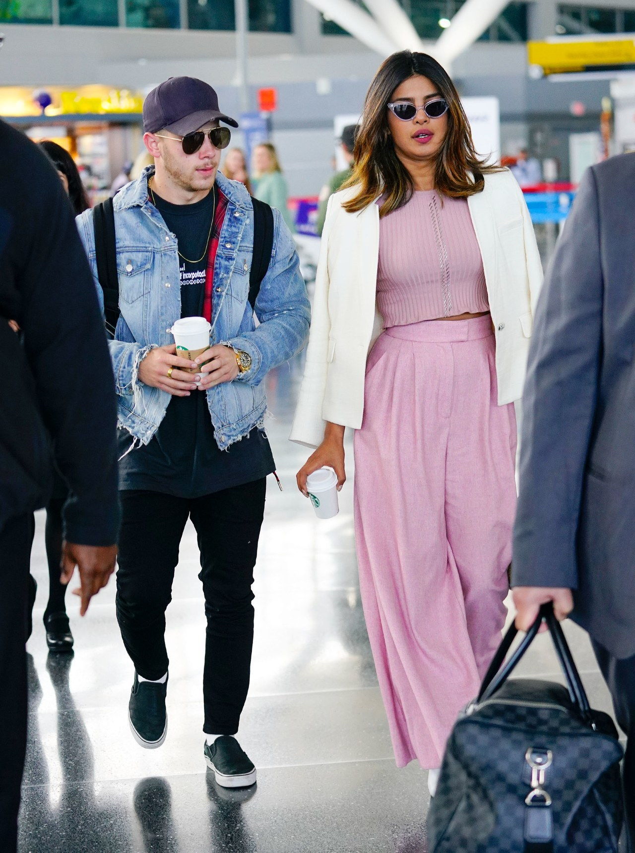 Mella Jonas and Priyanka Chopra arrive at JFK Airport together in New York